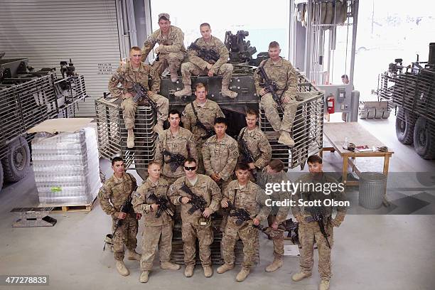 Soldiers with 4th Squadron 2d Cavalry Regiment pose with a Stryker vehicle after they turned it in to the Redistribution Property Accountability Team...