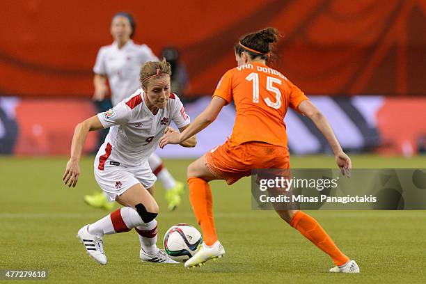 Josee Belanger of Canada tries to move the ball past Merel Van Dongen of the Netherlands during the 2015 FIFA Women's World Cup Group A match at...