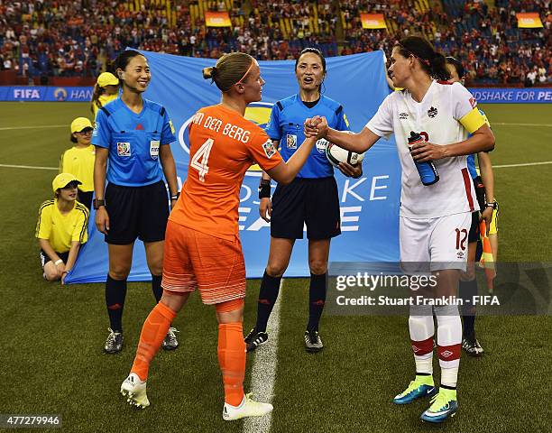 Christine Sinclair of Canada and Mandy Van den Berg of The Netherlands make the Handshake for Peace with the match officials during the FIFA Women's...