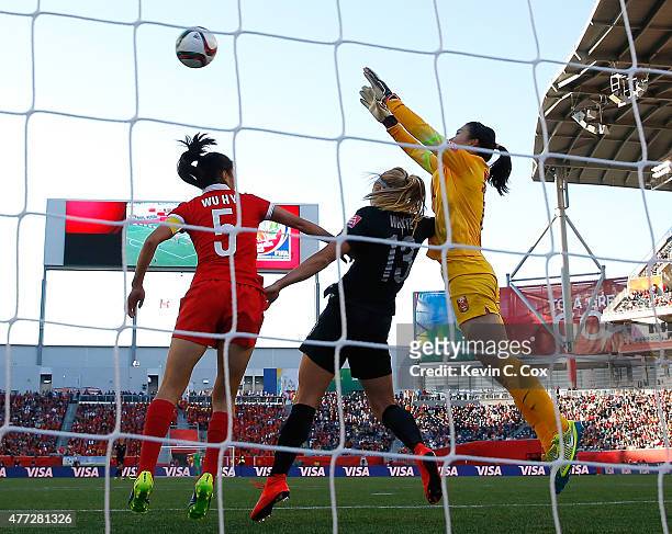 Goalkeeper Wang Fei of China PR saves a shot against Rosie White of New Zealand during the FIFA Women's World Cup Canada 2015 Group A match between...