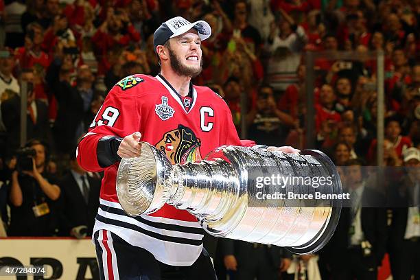 Jonathan Toews of the Chicago Blackhawks celebrates by hoisting the Stanley Cup after defeating the Tampa Bay Lightning by a score of 2-0 in Game Six...