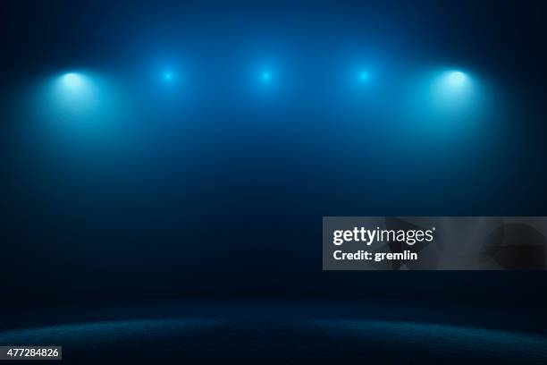 empty stage with spotlights - dark space stockfoto's en -beelden