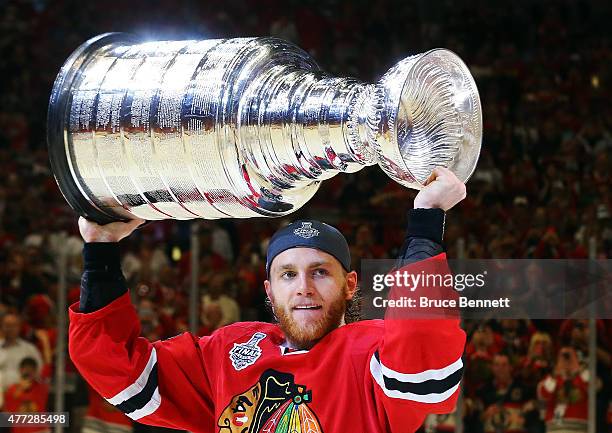 Patrick Kane of the Chicago Blackhawks celebrates by hoisting the Stanley Cup after defeating the Tampa Bay Lightning by a score of 2-0 in Game Six...