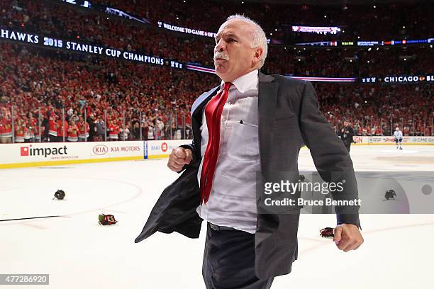 Head coach Joel Quenneville of the Chicago Blackhawks celebrates after defeating the Tampa Bay Lightning by a score of 2-0 in Game Six to win the...