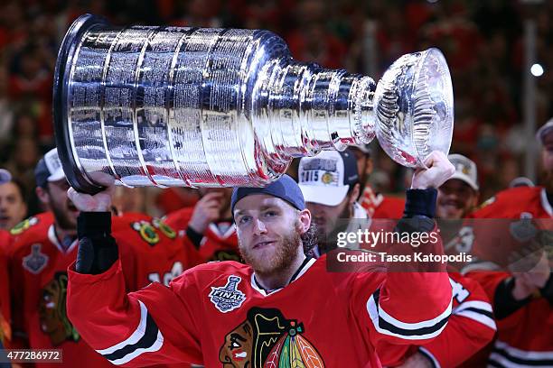 Patrick Kane of the Chicago Blackhawks celebrates by hoisting the Stanley Cup after defeating the Tampa Bay Lightning by a score of 2-0 in Game Six...