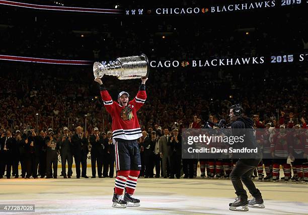 Jonathan Toews of the Chicago Blackhawks lifts the Stanley Cup in celebration after his team defeated the Tampa Bay Lightning 2-0 in Game Six of the...