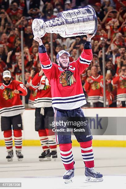 Jonathan Toews of the Chicago Blackhawks celebrates with the Stanley Cup after defeating the Tampa Bay Lightning 2-0 in Game Six to win the 2015 NHL...