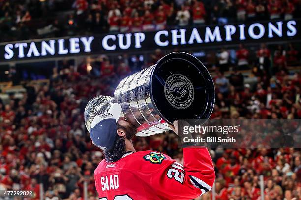 Brandon Saad of the Chicago Blackhawks celebrates with the Stanley Cup after defeating the Tampa Bay Lightning 2-0 in Game Six to win the 2015 NHL...