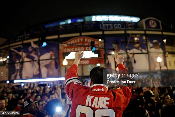 Fans celebrate the Chicago Blackhawks winning the 2015 Stanley Cup outside of Wrigley Field on June 15, 2015 in Chicago, Illinois.