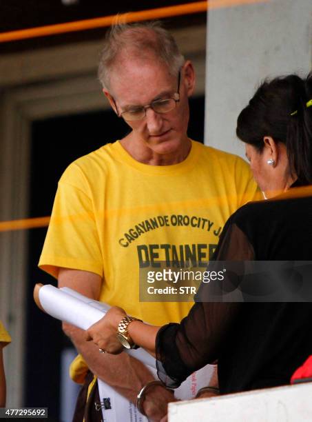 Peter Scully of Australia , accused of raping and trafficking two girls in the Philippines, arrives at a court for his arraignment in Cagayan de Oro...