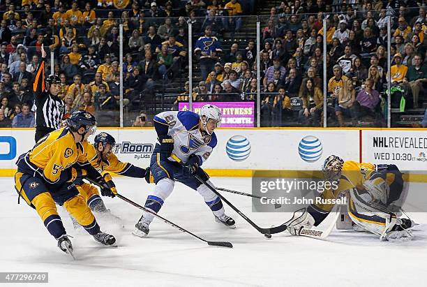 Alexander Steen of the St. Louis Blues shoots the puck against goalie Pekka Rinne as Shea Weber and Roman Josi of the Nashville Predators defend at...