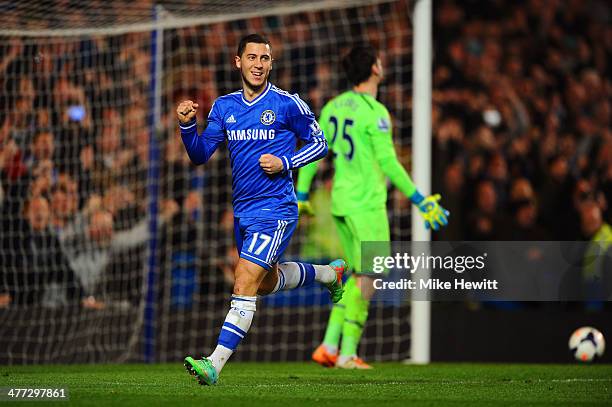 Eden Hazard of Chelsea celebrates after scoring his team's second goal from the penalty spot past goalkeeper Hugo Lloris of Spurs during the Barclays...