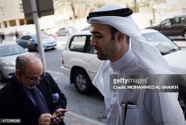 Bahraini lawyer, S Mohsin Al Alawi and Abduljalil Khalil , the leader in the main opposition party Al-Wefaq, leave a court building after attending...