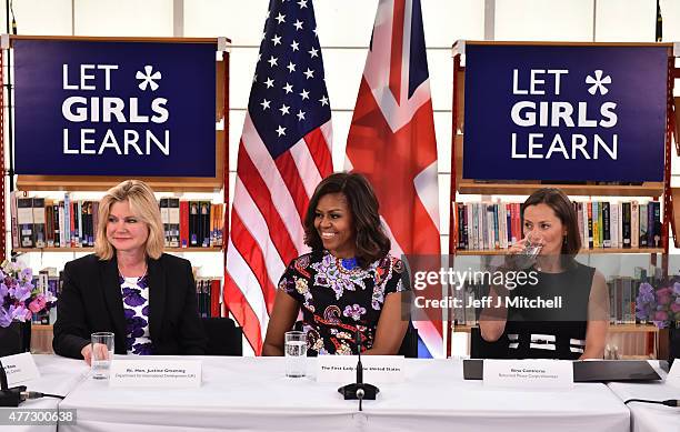 First Lady Michelle Obama sits between The UK Department of International Development's Justine Greening and returned Peace Corps Volunteer Bina...