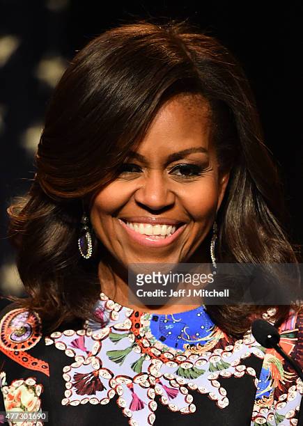 First Lady Michelle Obama smiles as she speaks to students as part of the 'Let Girls Learn Initiative' at the Mulberry School for Girls on June 16,...