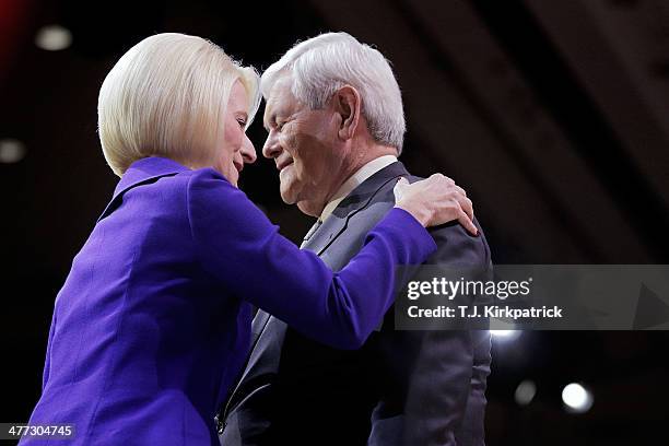 Callista Gingrich, left, greets her husband, former Speaker of the House Newt Gingrich, after introducing him to speak during the 41st annual...