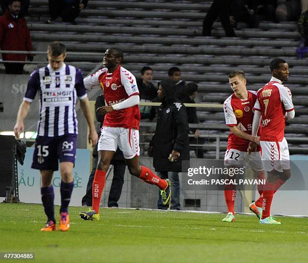 Reims French forward Nicolas De Preville is congratulated by teammates after scoring durijng the French L1 football match Toulouse FC against Stade...