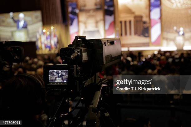 Newt Gingrich, former speaker of the U.S. House of Representatives, waves as he leaves the stage during the 41st annual Conservative Political Action...