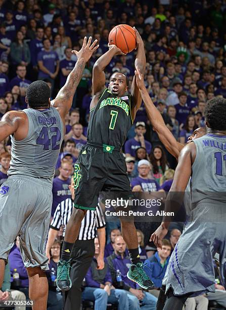 Guard Kenny Chery of the Baylor Bears hits a shot over forward Thomas Gipson of the Kansas State Wildcats during the first half on March 8, 2014 at...