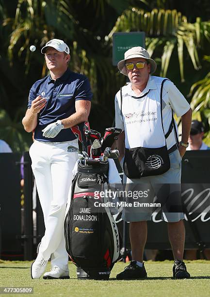 Jamie Donaldson of Wales waits with his caddie Mick Donaghy on the eighth hole during the third round of the World Golf Championships-Cadillac...