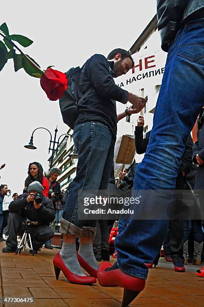 Bulgarian men wear high heels during the celebration of International Womens Day in the capital Sofia, Bulgaria on March 8, 2014. Bulgarians mark out...