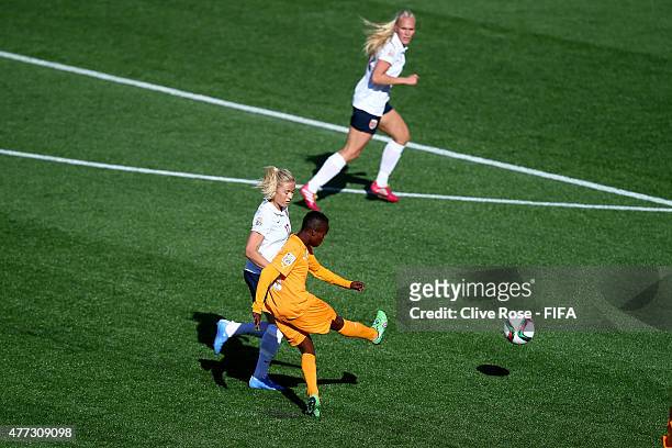 Ange Nguessan of Cote D'Ivoire shoots to score her spectacular goal during the FIFA Women's World Cup 2015 Group B match between Cote D'Ivoire and...