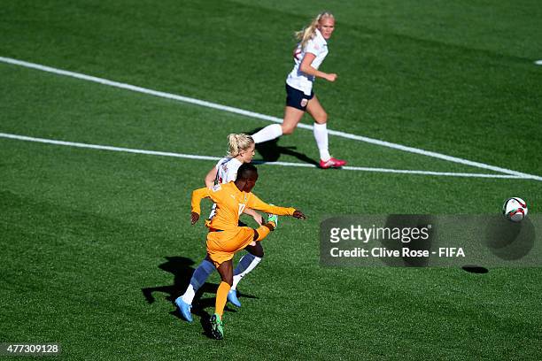 Ange Nguessan of Cote D'Ivoire shoots to score her spectacular goal during the FIFA Women's World Cup 2015 Group B match between Cote D'Ivoire and...