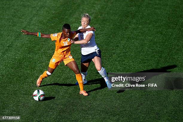 Binta Diakite of Cote D'Ivoire is challanged by Lene Mykjaland of Norway during the FIFA Women's World Cup 2015 Group B match between Cote D'Ivoire...