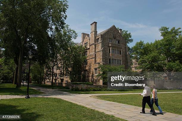 Pedestrians walk down a path on the Yale University campus in New Haven, Connecticut, U.S., on Friday, June 12, 2015. Yale University is an...