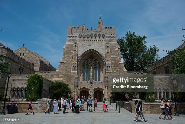 Tour group makes a stop at the Sterling Memorial Library on the Yale University campus in New Haven, Connecticut, U.S., on Friday, June 12, 2015....
