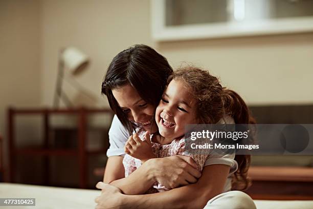 mother and daughter having fun - kids hug ストックフォトと画像