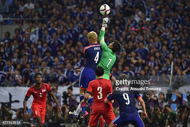 Keisuke Honda of Japan competes against Mohamad Izwan Bin Mahbud of Singapore during the 2018 FIFA World Cup Asian Qualifier second round match...