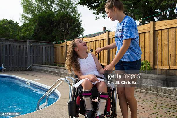 Alessia Commisso left, and Weronika Rodowicz, 13 share a joke in the Commisso family back yard. Sonia Commisso the mother of Alessia, 12 is...