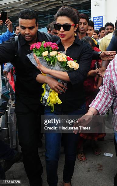 Bollywood actor Priyanka Chopra being welcomed by fans during arrival at Raja Bhoj airport on June 16, 2015 in Bhopal, India. Priyanka arrived in...