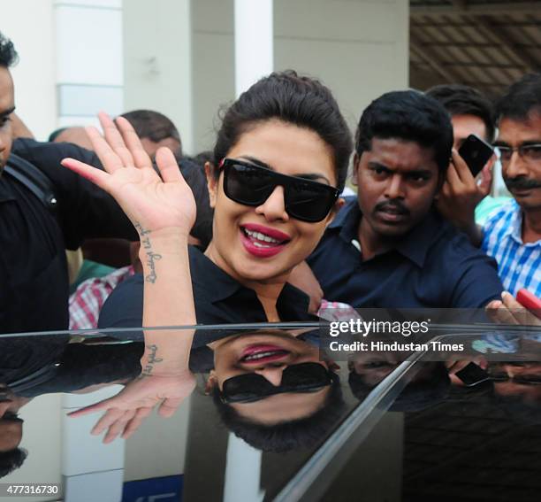 Bollywood actor Priyanka Chopra waving for fans during arrival at Raja Bhoj airport on June 16, 2015 in Bhopal, India. Priyanka arrived in Bhopal to...