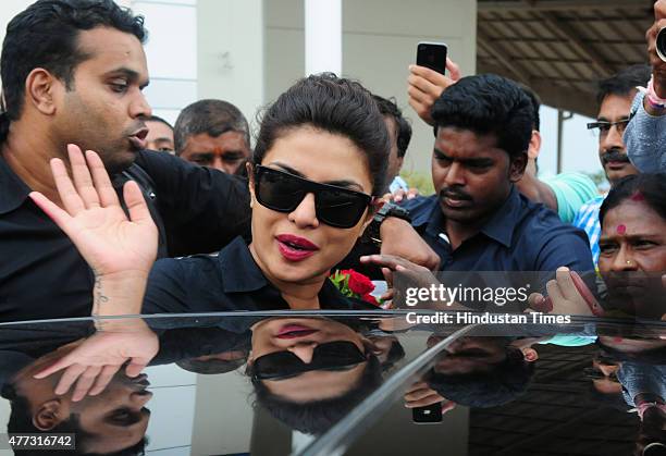 Bollywood actor Priyanka Chopra waving for fans during arrival at Raja Bhoj airport on June 16, 2015 in Bhopal, India. Priyanka arrived in Bhopal to...