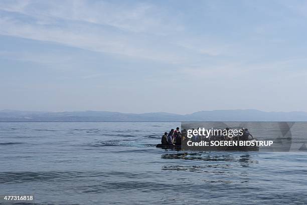 Refugees from Afghanistan arrive in a boat on the shores of Lesbos near Skala Skamnias, Greece on June 2, 2015. Lesbos, the Greek vacation island in...