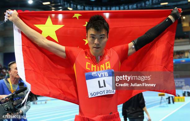 Jinzhe Li of China celebrates the silver medal in the Men's Long Jump Final during day two of the IAAF World Indoor Championships at Ergo Arena on...