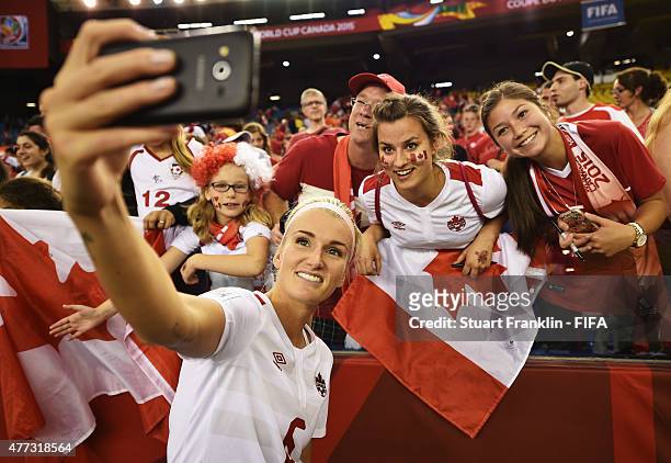Kaylyn Kyle of Canada celebrates with fans at the end of the FIFA Women's World Cup Group A match between Netherlands and Canada at Olympic Stadium...