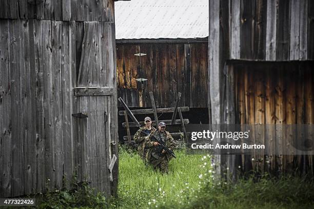 Task force of U.S. Marshalls and police officers go door to door searching for two escaped convicts on June 16, 2015 outside Dannemora, New York. The...