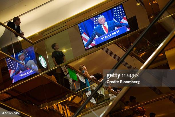 Donald Trump, president and chief executive of Trump Organization Inc., is seen on a television announcing he will seek the 2016 Republican...