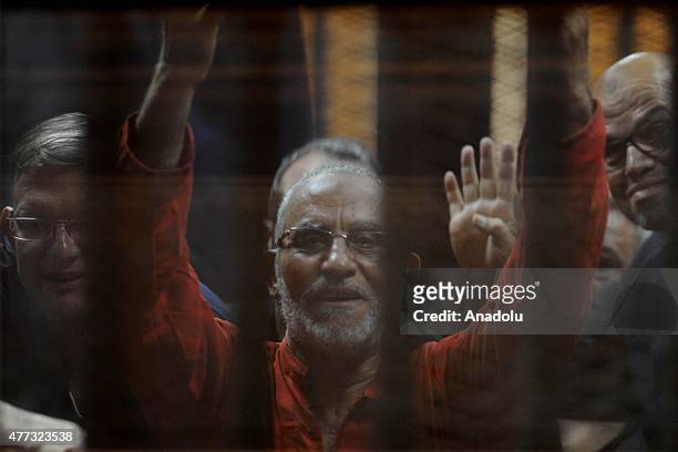 Mohammed Badie , Supreme Guide of the Muslim Brotherhood seen inside a cage in the courtroom where he stood trial during the trial in Cairo on June...