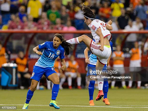 Silvia Meseguer of Spain jumps near Raquel Fernandes of Brazil during the 2015 FIFA Women's World Cup Group E match at Olympic Stadium on June 13,...