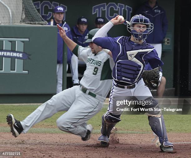 After beating Jimmy Pickens of Michigan State to home plate, Texas Christian catcher Kyle Bacak throws to first base to complete a double play at...