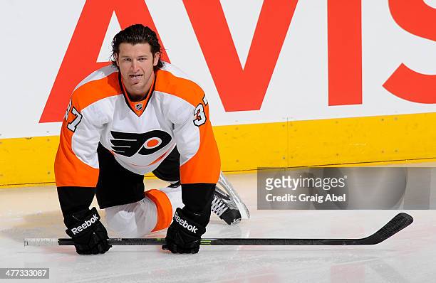 Jay Rosehill of the Philadelphia Flyers stretches during warm up prior to NHL game action against the Toronto Maple Leafs March 8, 2014 at the Air...