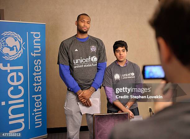 Athlete DeMarcus Cousins of The Sacramento Kings and a student from The United Nations International School attend an event recognizing New York City...