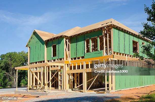 new home under construction - timber window frames stock pictures, royalty-free photos & images