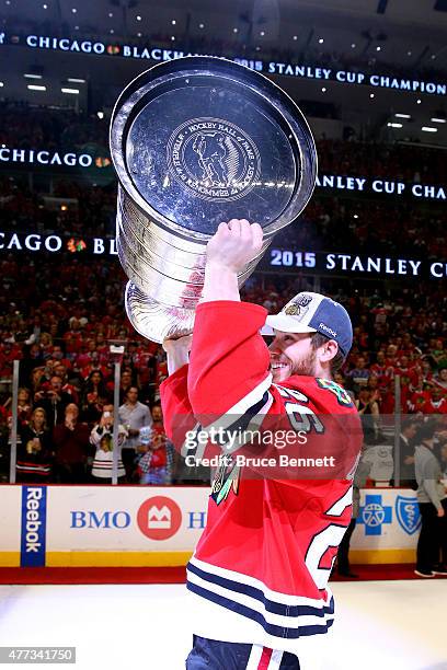 Kyle Cumiskey of the Chicago Blackhawks celebrates with the Stanley Cup after defeating the Tampa Bay Lightning by a score of 2-0 in Game Six to win...