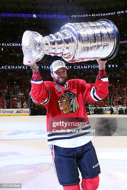 David Rundblad of the Chicago Blackhawks celebrates with the Stanley Cup after defeating the Tampa Bay Lightning by a score of 2-0 in Game Six to win...