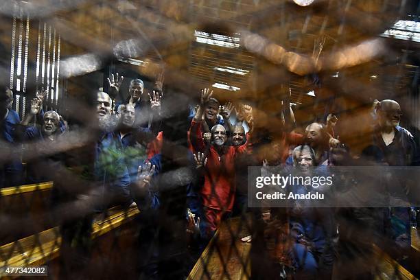 Mohammed Badie , Supreme Guide of the Muslim Brotherhood seen inside a cage in the courtroom where he stood trial during the trial in Cairo on June...